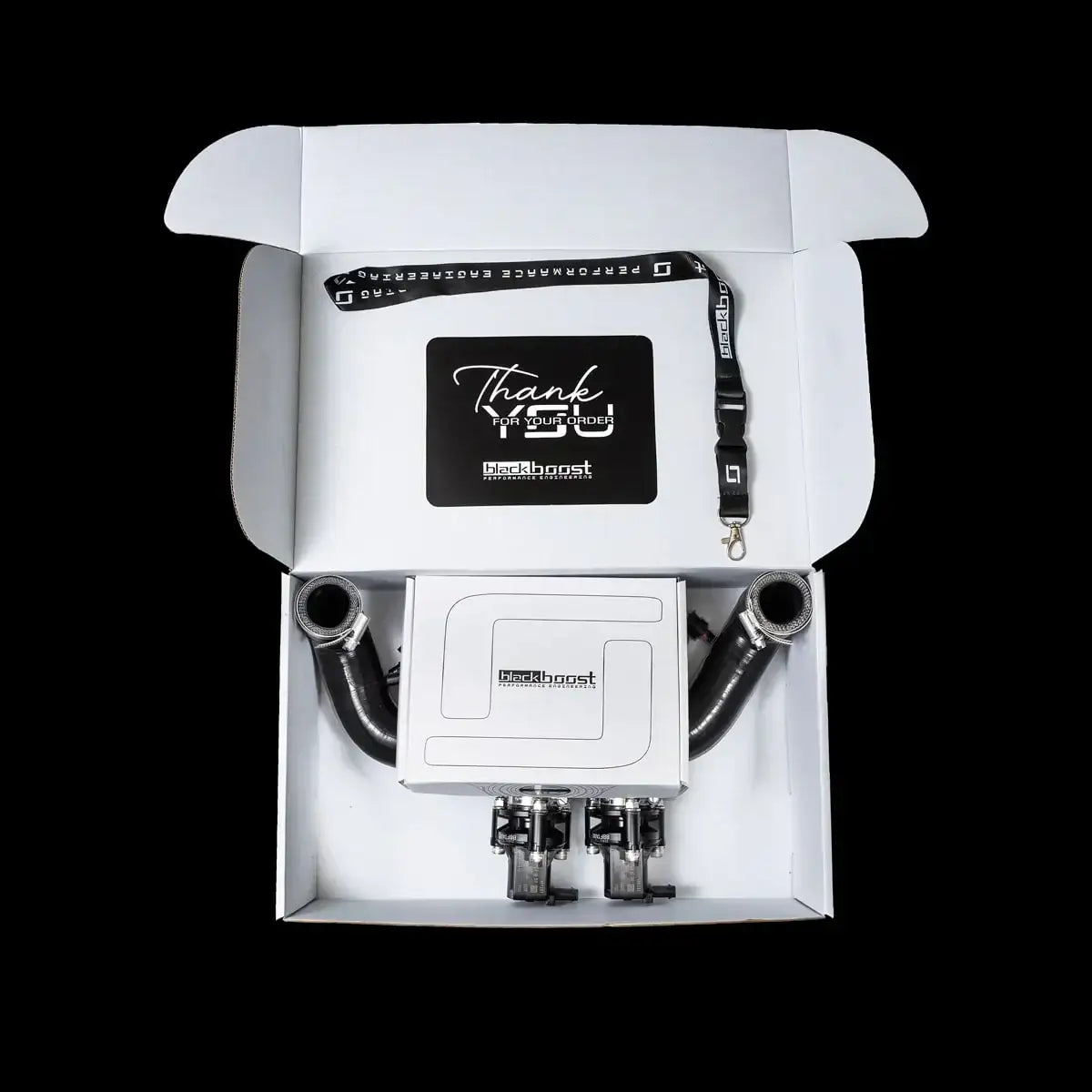 blackboost Quad Valve Kit in geöffneter Box mit Schläuchen, Lanyard und Dankeskarte, Tuning-Teile KTH Shop