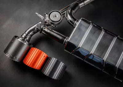 Nissan Z | Capristo - Exhaust system with central silencer replacement pipes, colored anodized tailpipes in black, red, silver*, carbon or aluminum outer sleeve in Wicrom Black and EVCU-1